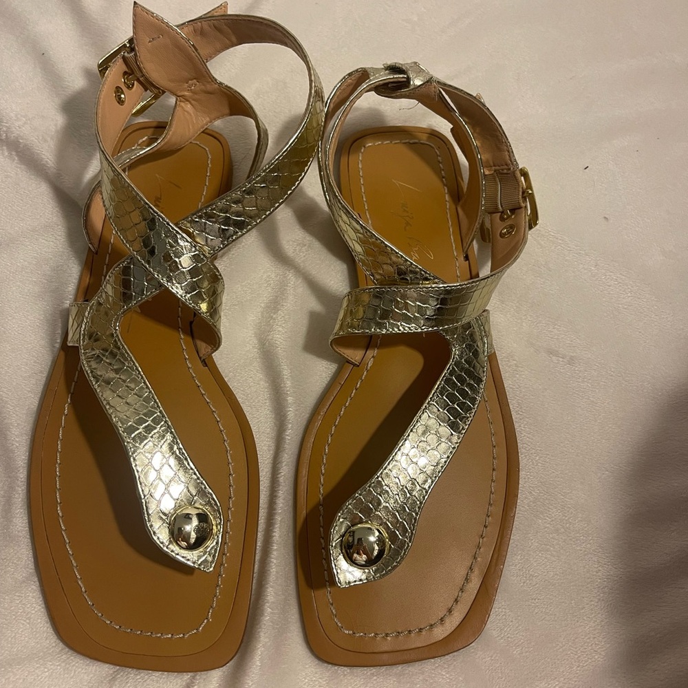 Luiza Barcelos flat sandal in metallic gold leather.